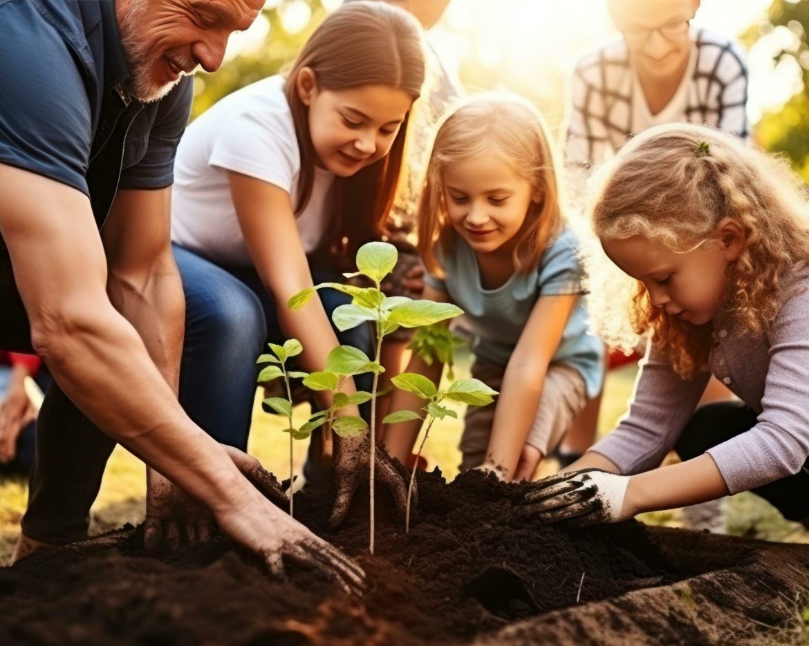 family-planting-tree-in-garden-free-photo